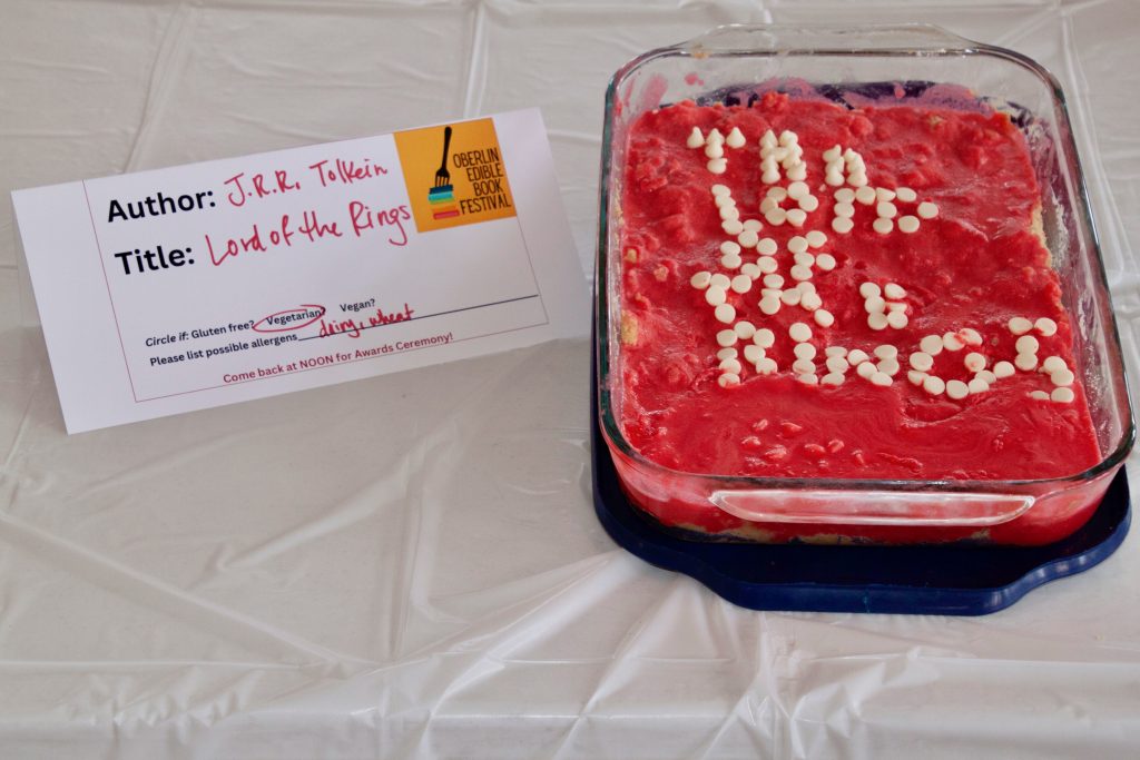 Photo of submission titled, "Lord of the Rings" featuring a red dessert casserole with the title spelled out in white chocolate drops
