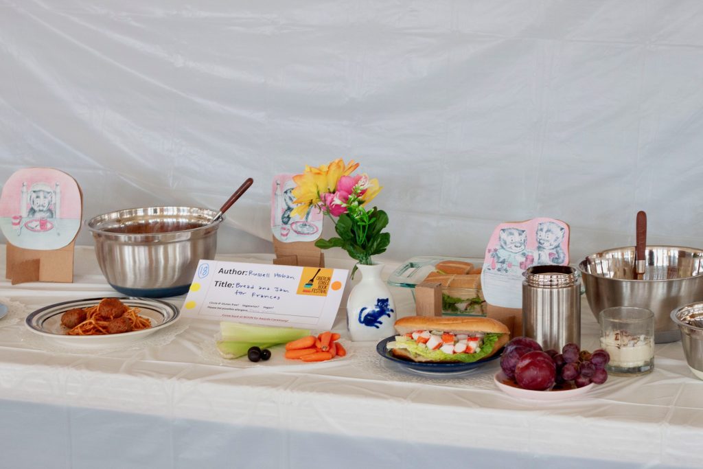 Photo of submission titled, "Bread and Jam for Frances" featuring several food items contained in the book along with cutout images from the book